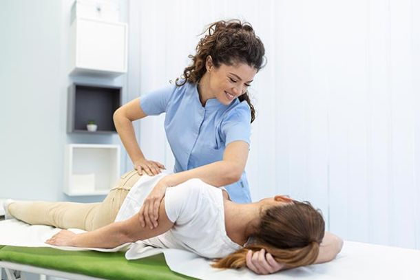 family chiropractor helping realign patient